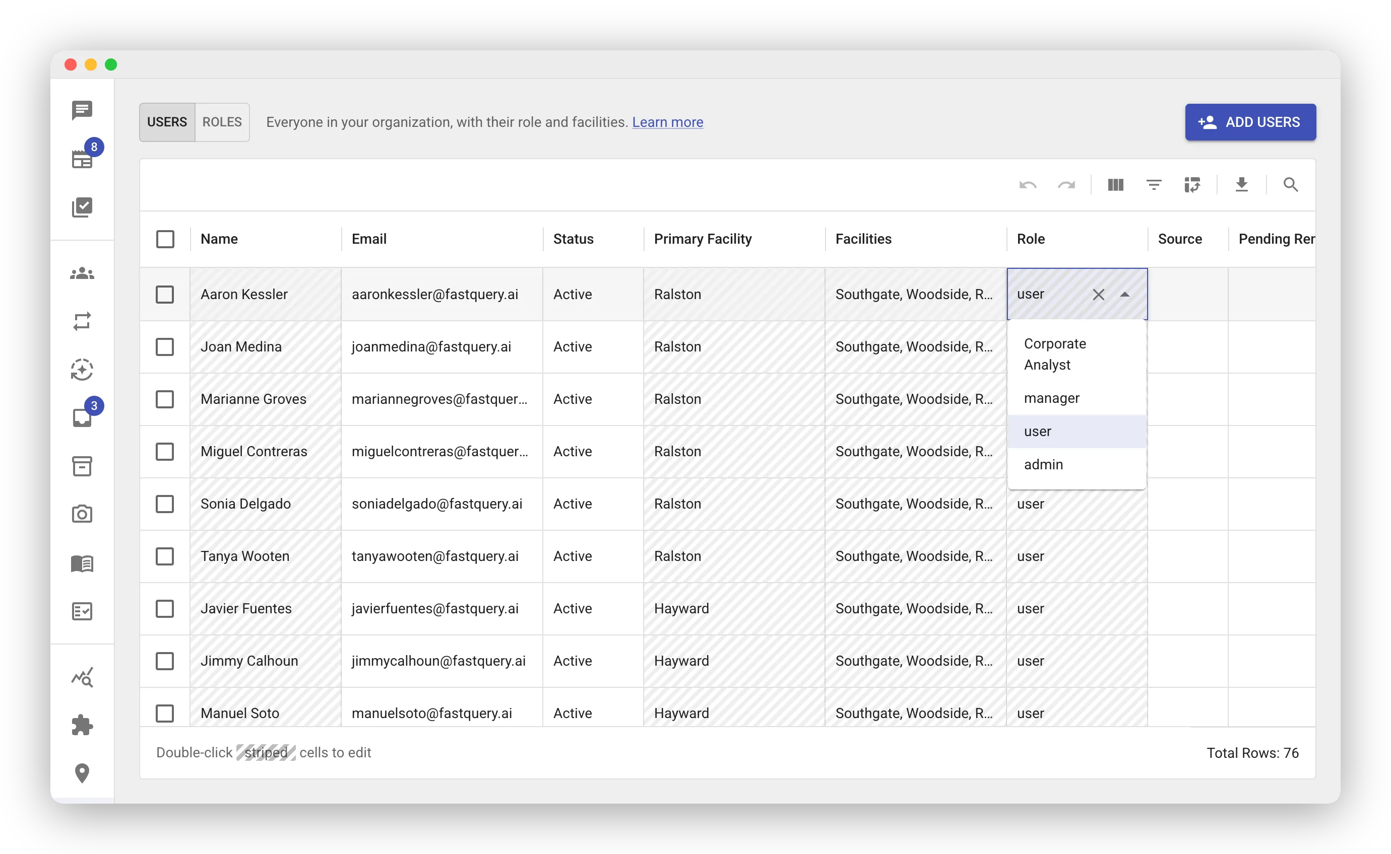 The Users grid with the Role cell of one member open for editing. A dropdown lists the available roles: Corporate Analyst, manager, user, and admin.