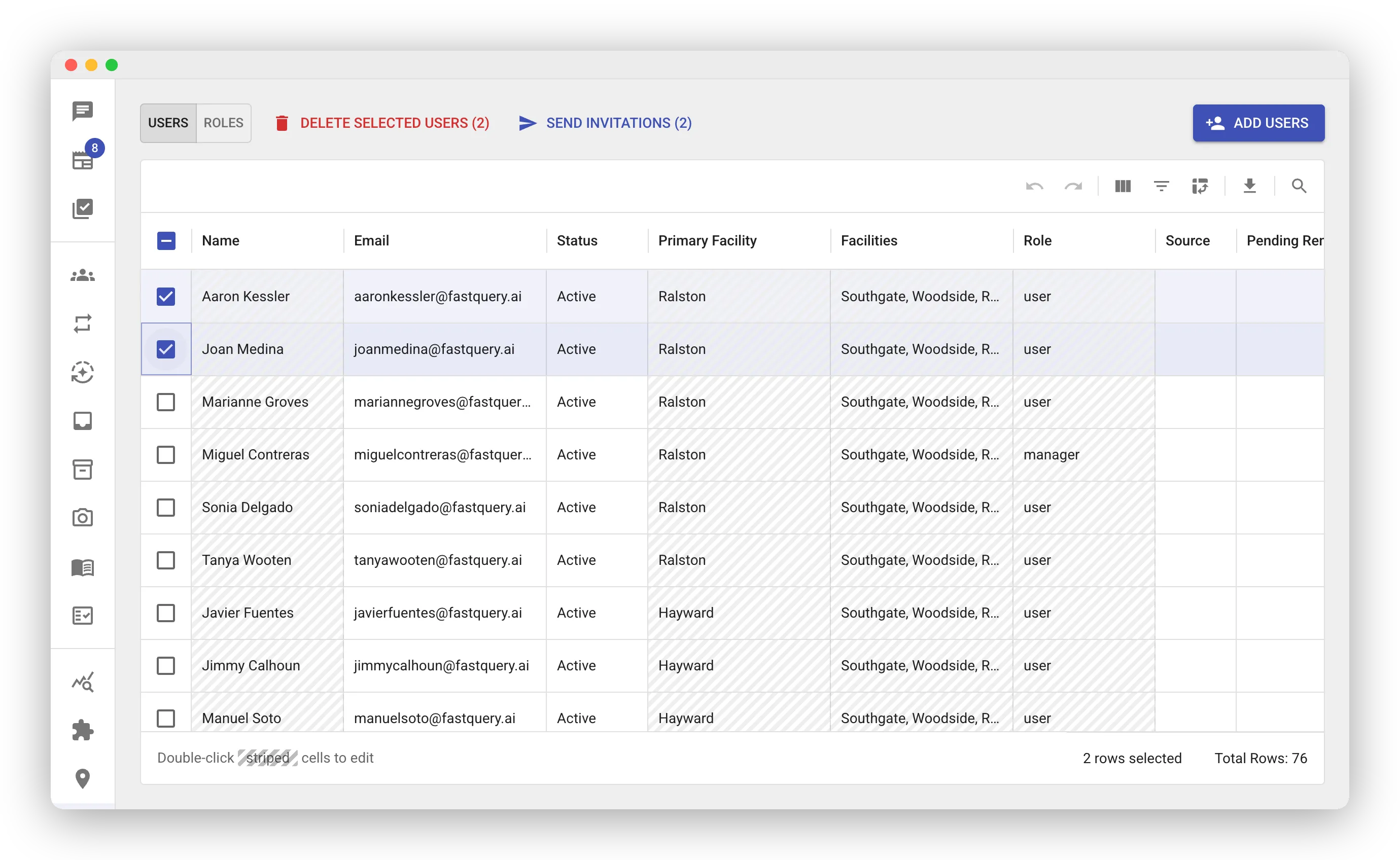 The Users grid with two rows selected. The toolbar above the grid shows a red DELETE SELECTED USERS (2) action and a SEND INVITATIONS (2) action. The footer reads “2 rows selected”.