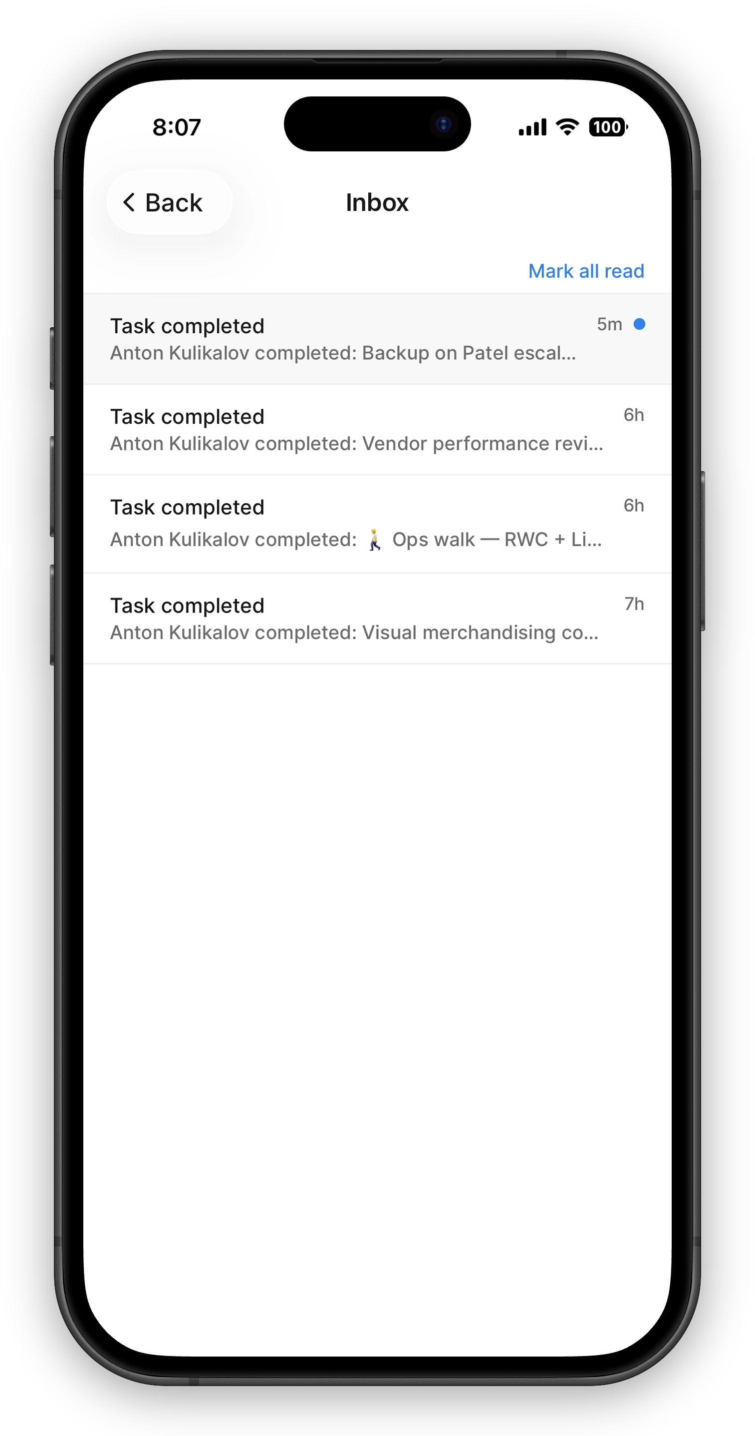 The Inbox screen on mobile listing task notifications — "Task completed" rows with who completed what and how long ago. The newest row is highlighted with a blue unread dot, and a "Mark all read" link sits above the list.